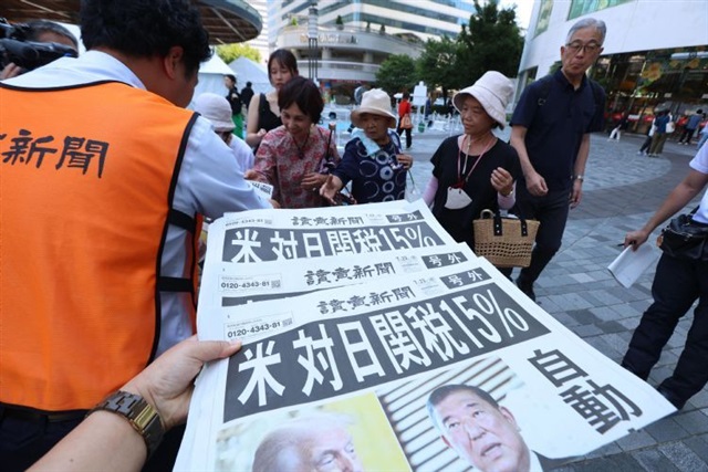 What did Japan give up to lower US tariffs?