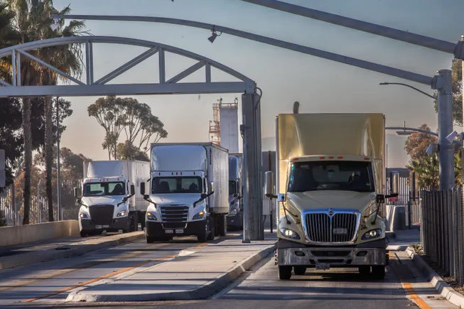US formalizes tariffs on trucks, buses